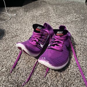 Purple Nike Free RN Flyknit tennis shoes